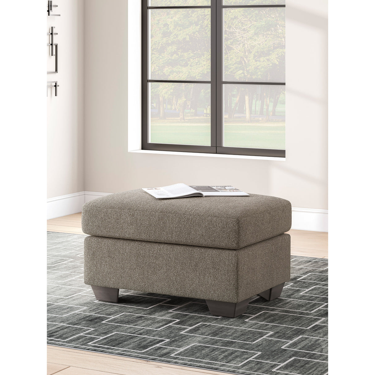 A room setting featuring Triston-Peaks Suede Ottoman