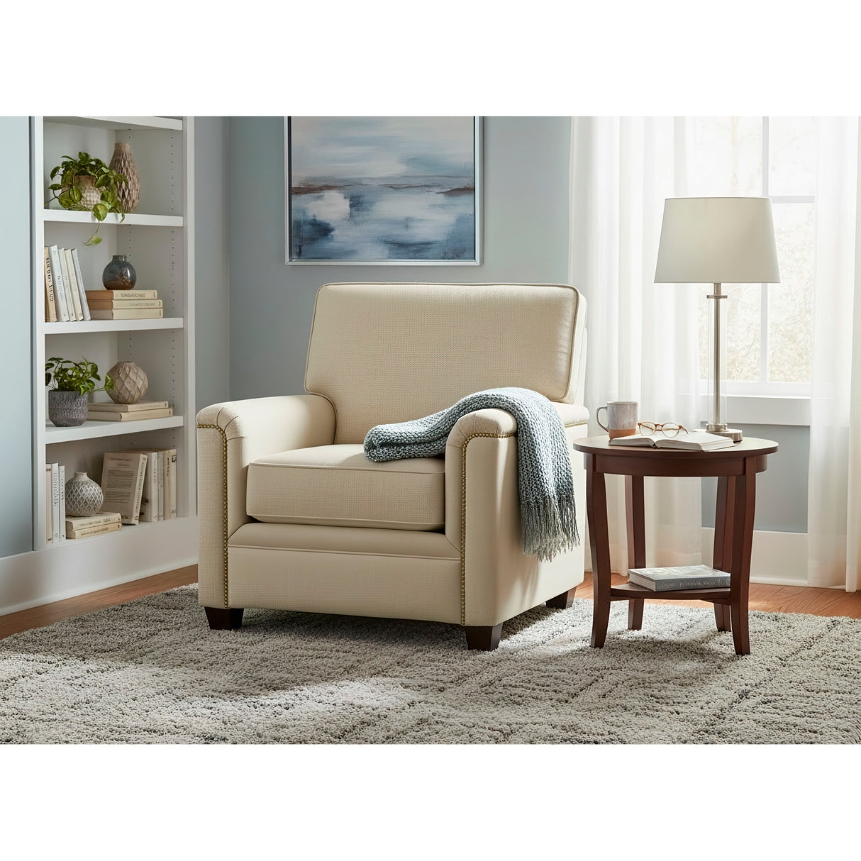 A room setting featuring Warren Twine Feather Blend Nail Head Chair