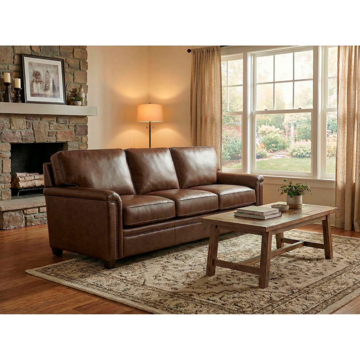 A room setting featuring Warren Chocolate Feather Blend Leather Nail Head Sofa