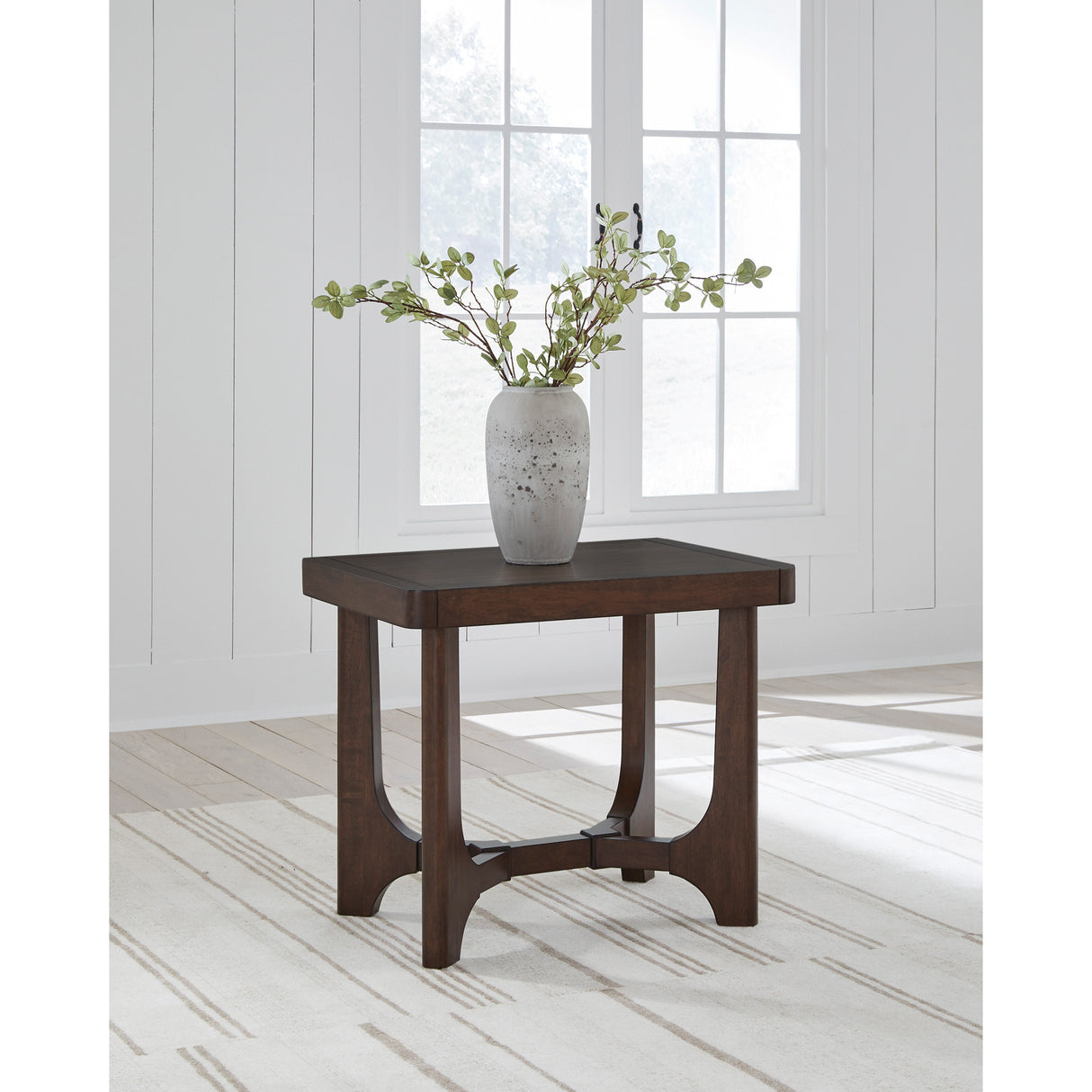 A room setting featuring Korestone Dark Brown End Table