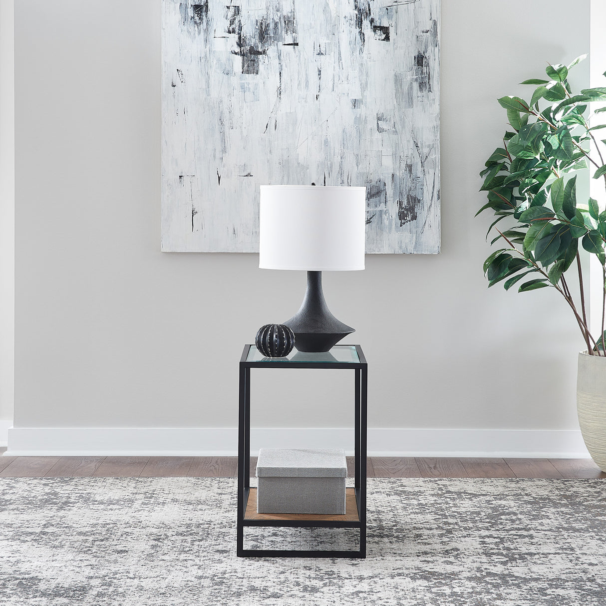 A room setting featuring Bedford Weathered Oak Chairside Table