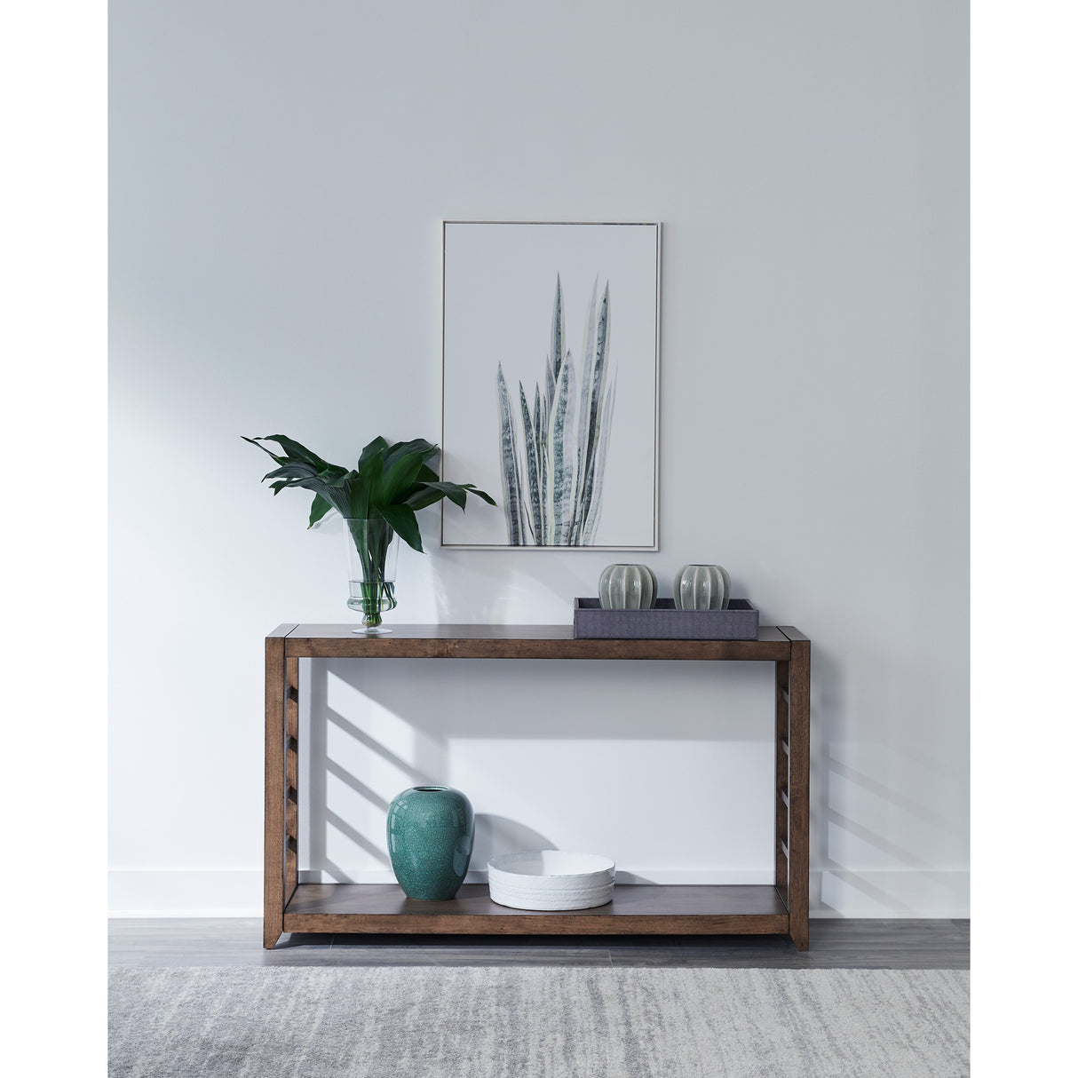 A room setting featuring Shaker Lakes Harvest Brown Sofa Table