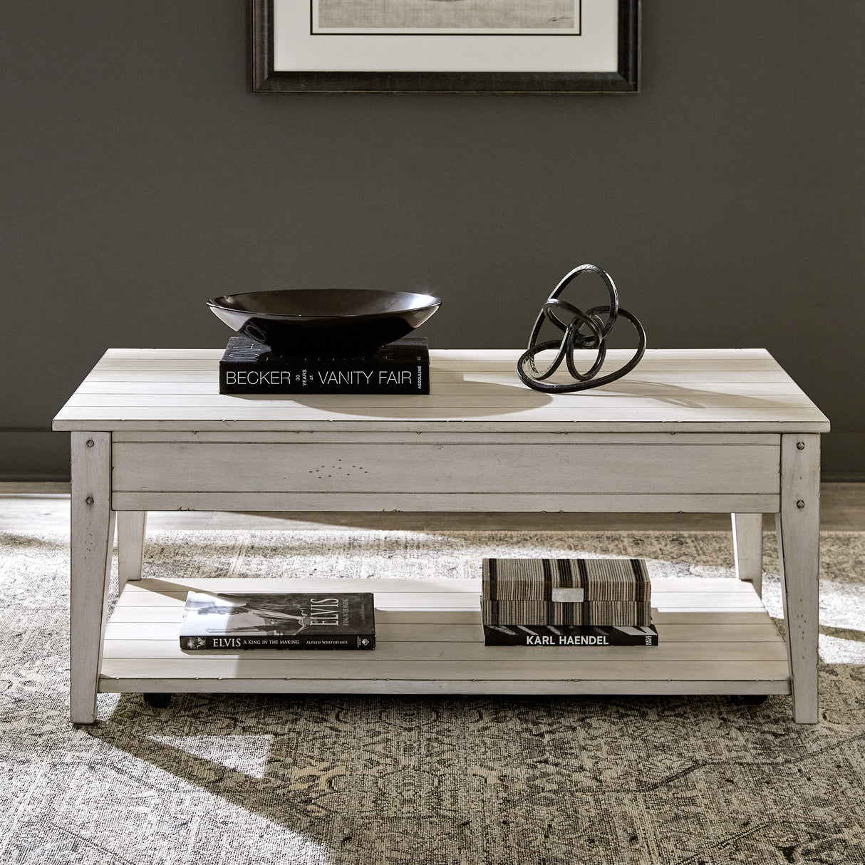 A room setting featuring Lake House Weathered White Lift Top Coffee Table
