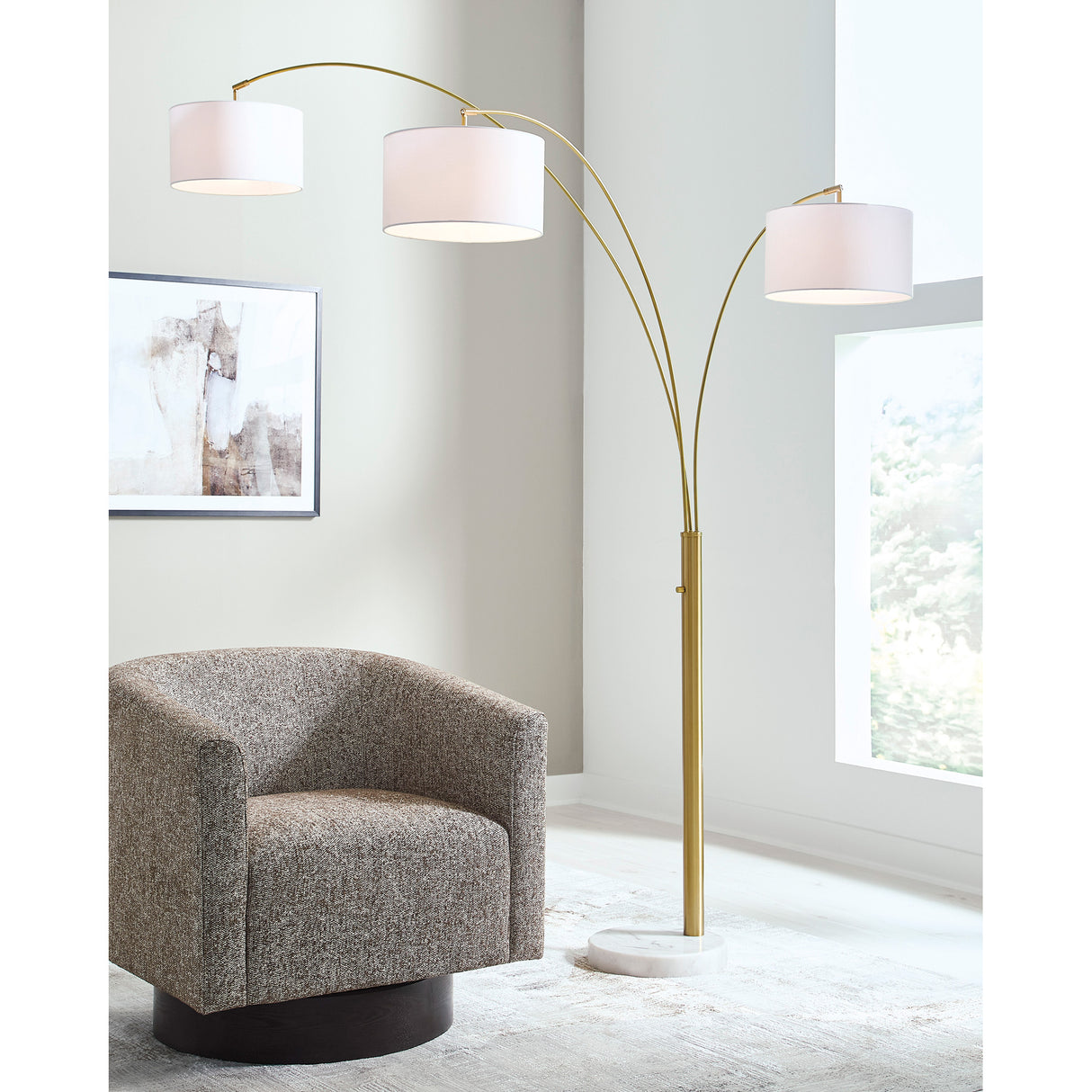 A room setting featuring Valo Gold Arc Lamp