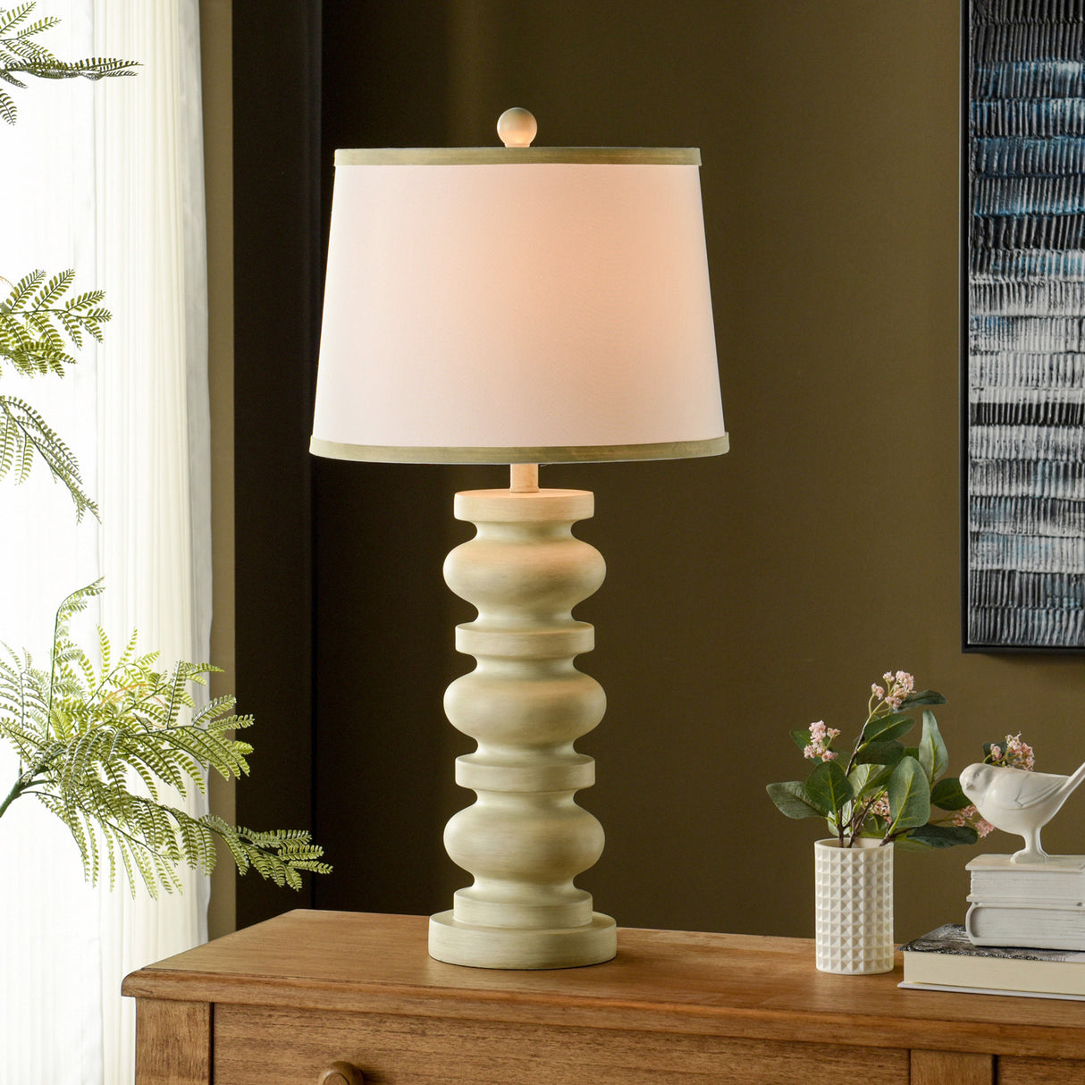 A room setting featuring Gambell Cream Table Lamp