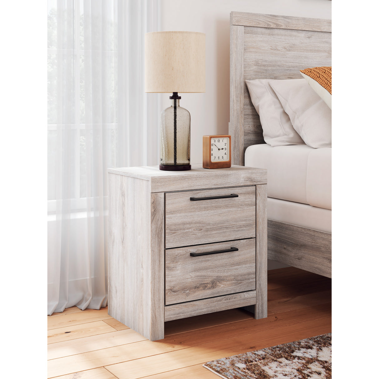 A room setting featuring Broachmyn Gray Nightstand