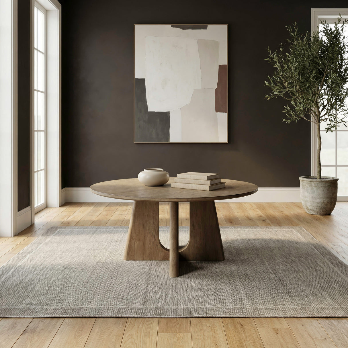 A room setting featuring Hendrix Natural Round Coffee Table