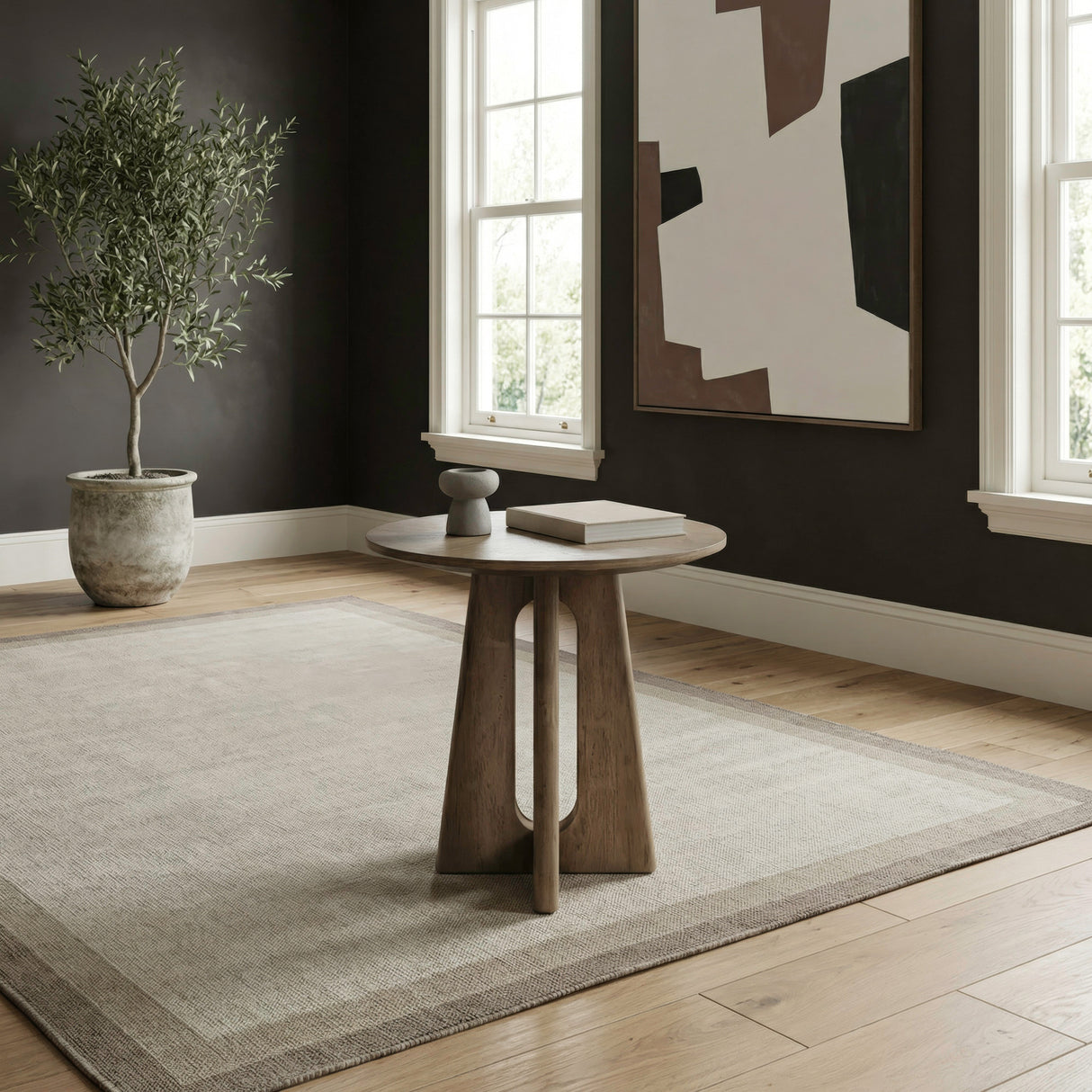 A room setting featuring Hendrix Natural Round End Table