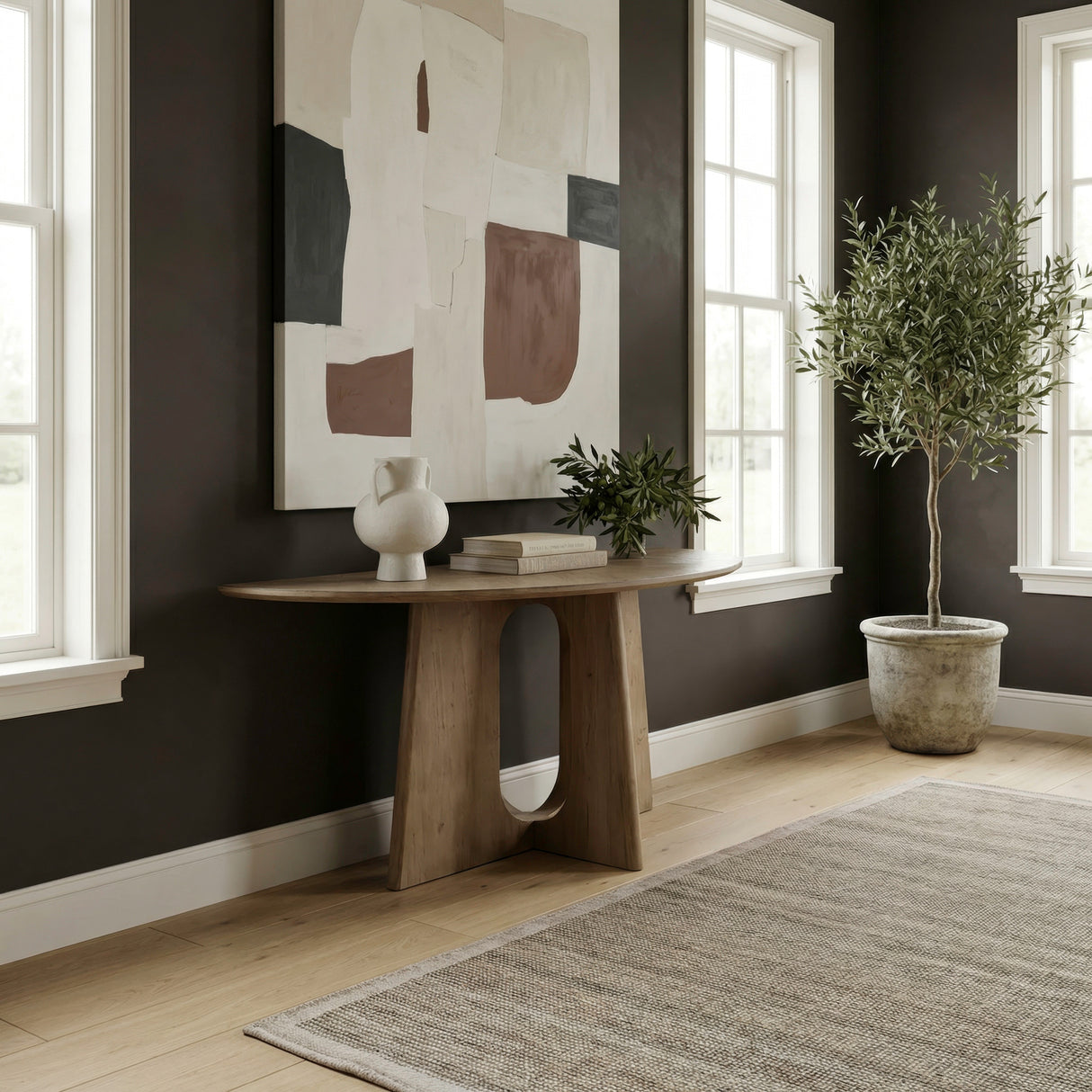 A room setting featuring Hendrix Natural Demilune Sofa Table