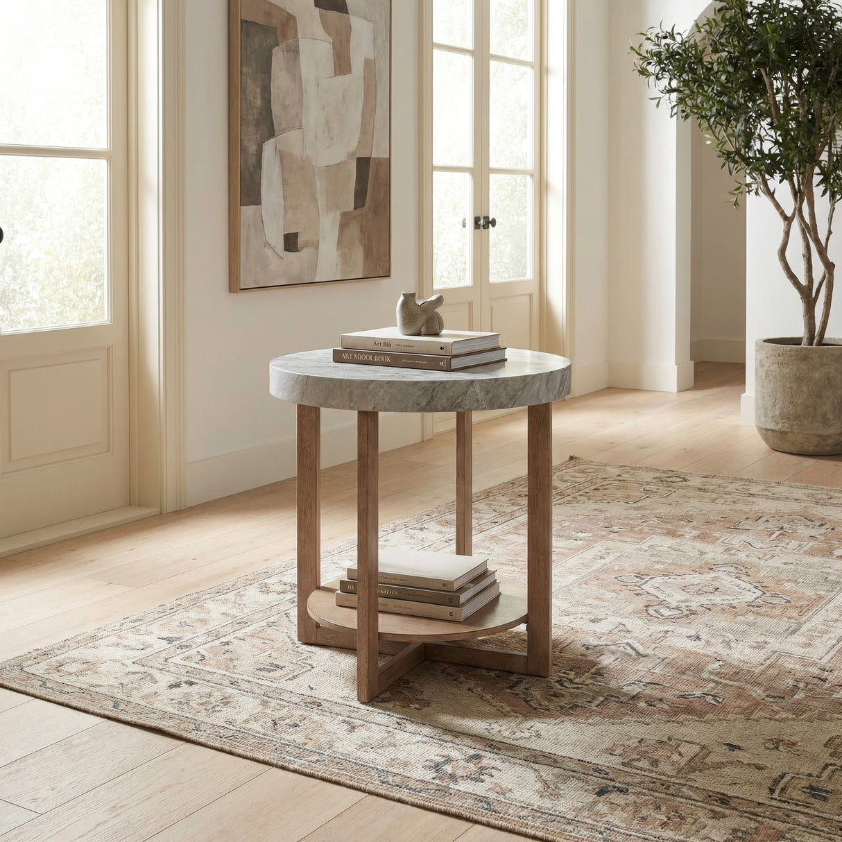 A room setting featuring Danby Alabaster Round End Table
