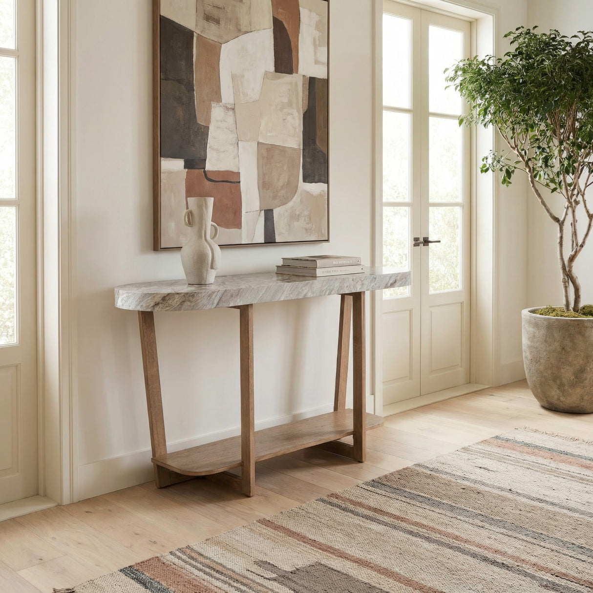 A room setting featuring Danby Alabaster Sofa Table