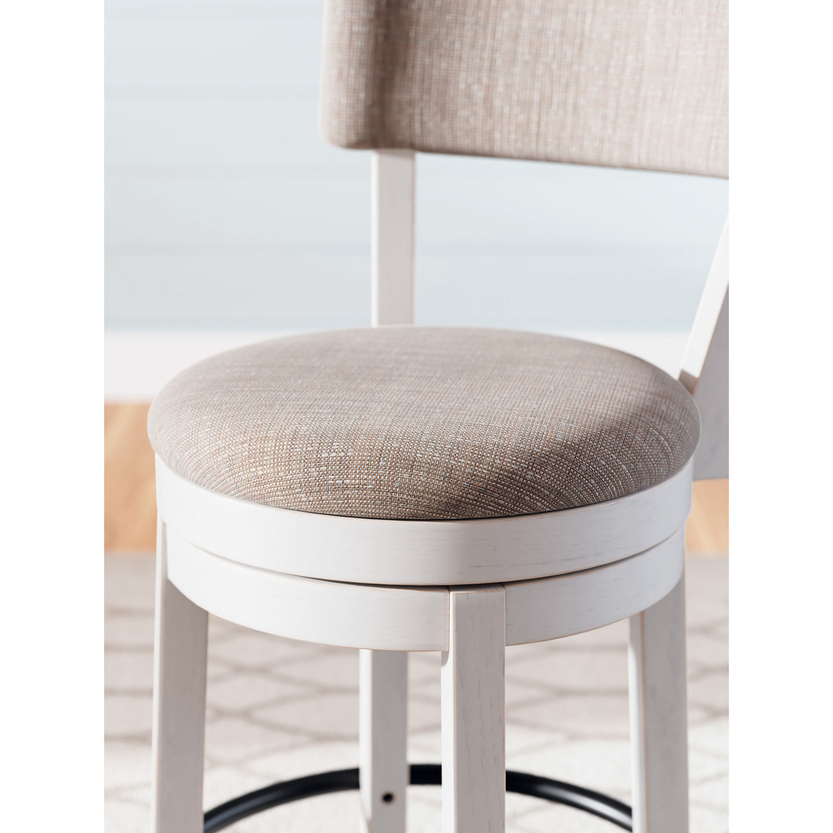 Detail view of Robbinsdale Antique White Upholstered Swivel Open Back Counter Stool