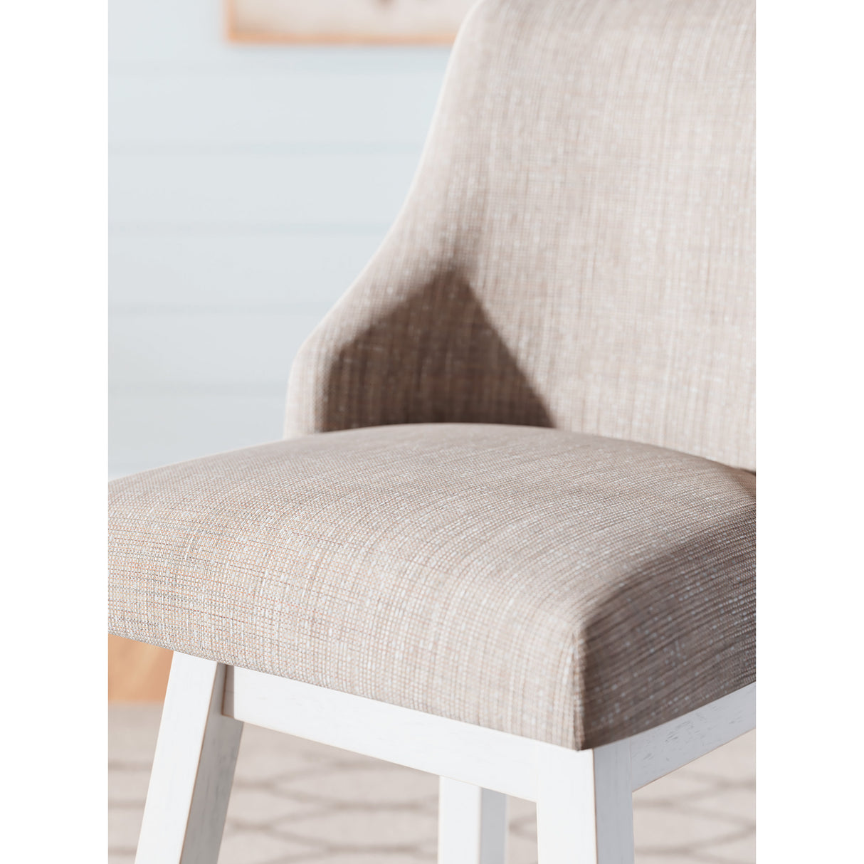 Detail view of Robbinsdale Antique White Upholstered Swivel Counter Stool