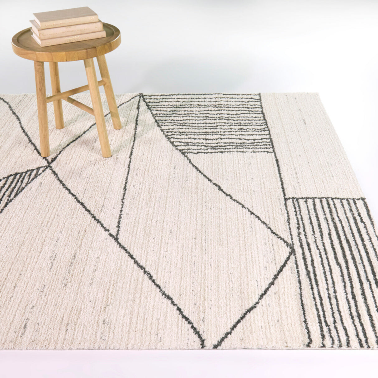 A room setting featuring Barrell Charcoal 8x10 Abstract Rug