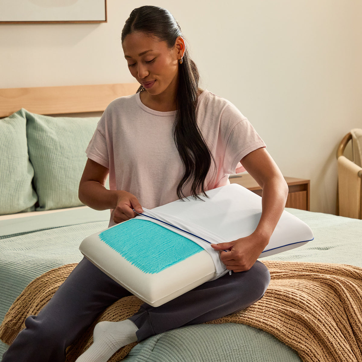 A room setting featuring Sealy Cool Comfort Enhanced Cooling Memory Foam Queen Pillow
