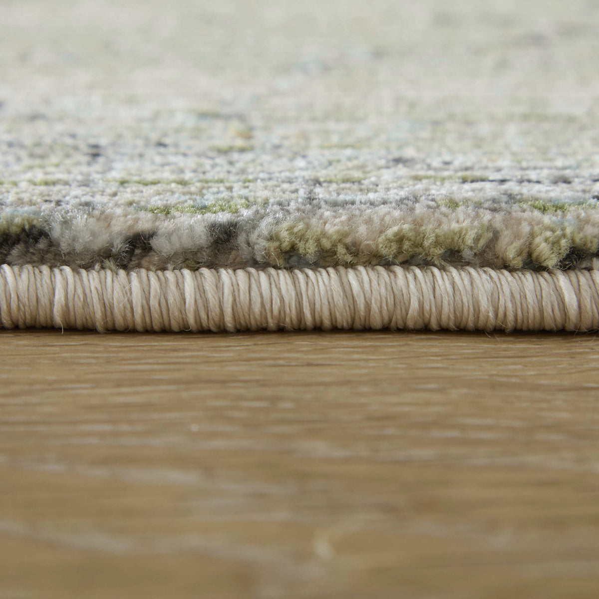 Side view of Sonora 39U8F Green 5x8 Rug