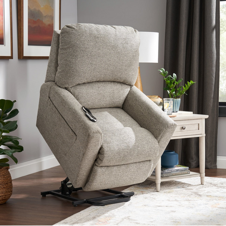Gray recliner chair in a living room setting with decor elements.