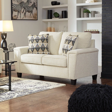 Gray loveseat with throw pillows