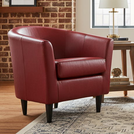 Red leather armchair in a room with a brick wall and wooden floor.