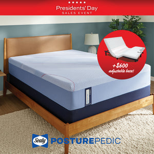 Sealy PosturePedic mattress with adjustable base on a wooden bed frame, during a Presidents' Day sales event.