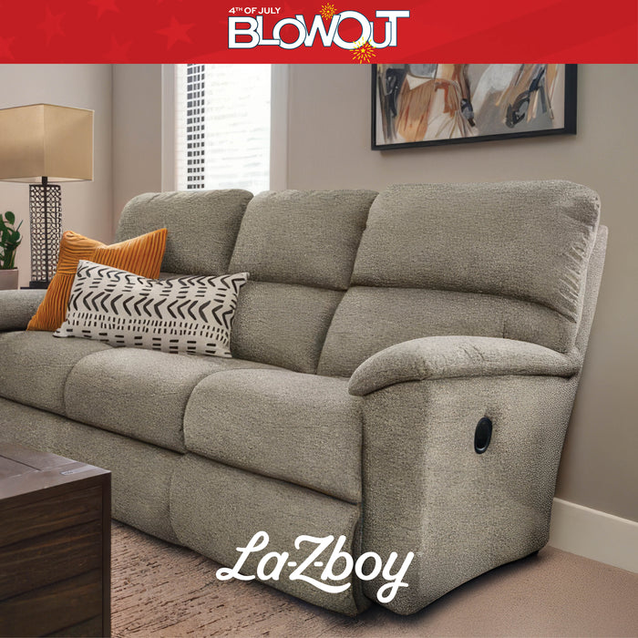 Gray La-Z-Boy sofa with decorative pillows in a living room setting, featuring a '4th of July Blowout' banner.