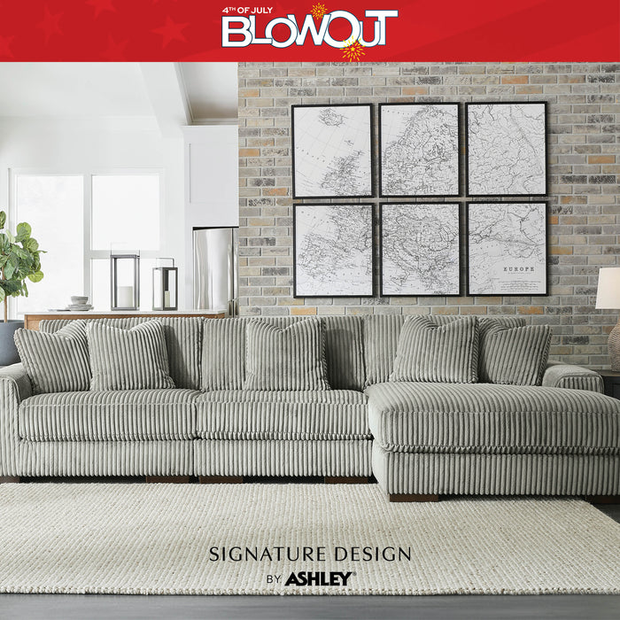 Gray sectional sofa in a living room with '4th of July Blowout' and 'Signature Design by Ashley' text.