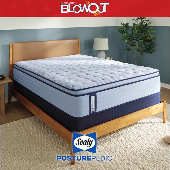 Sealy PosturePedic mattress on a bed with '4th of July Blowout' text and Sealy logo.