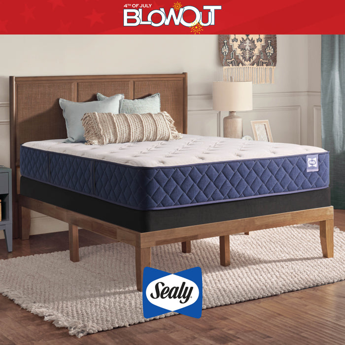 Sealy mattress on a wooden bed frame with '4th of July Blowout' text at the top.