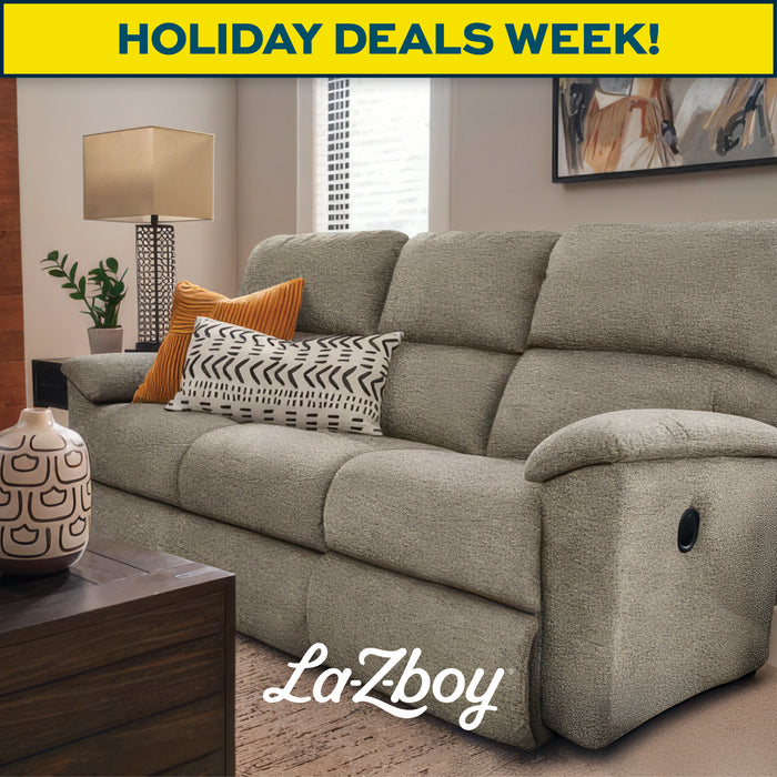 Gray La-Z-Boy sofa with decorative pillows in a living room setting, featuring a 'Holiday Deals Week!' banner.