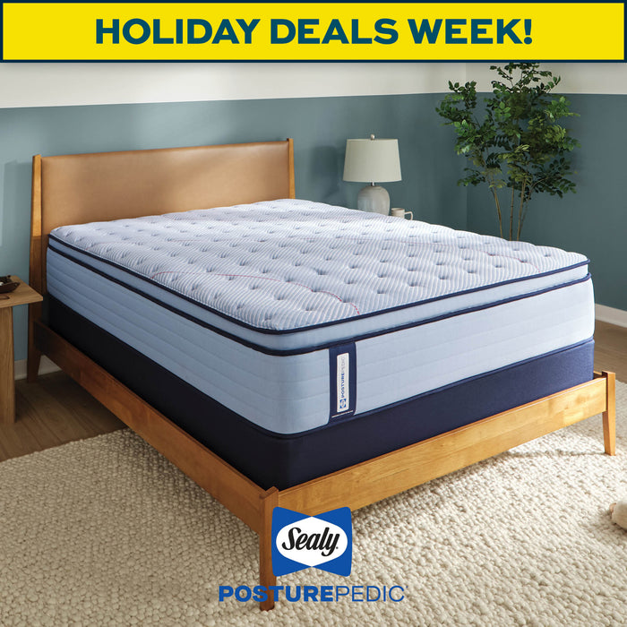 Sealy PosturePedic mattress on a wooden bed frame with 'Holiday Deals Week!' text and Sealy logo.