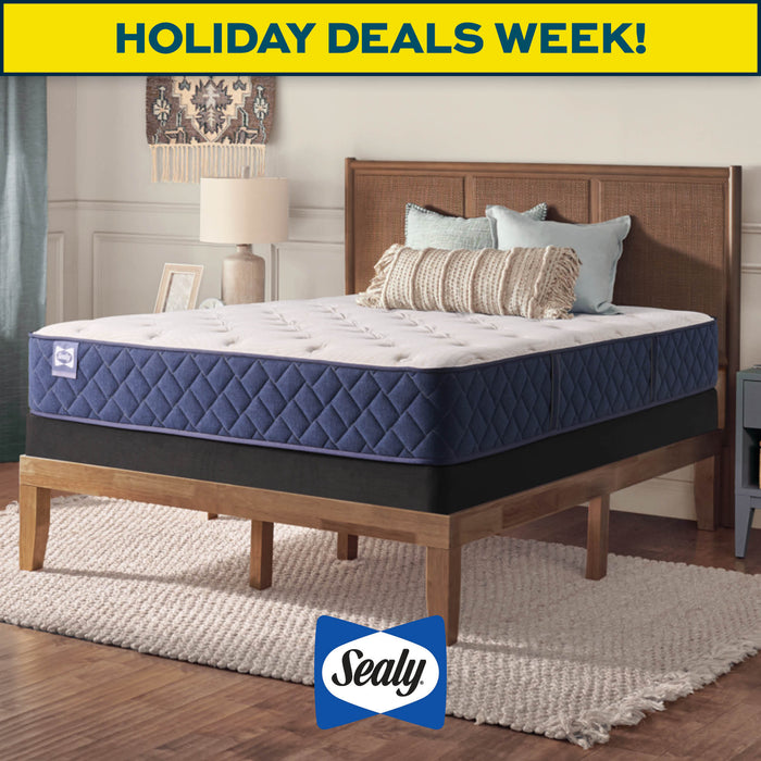 Sealy mattress on a bed with 'Holiday Deals Week!' text and Sealy logo.