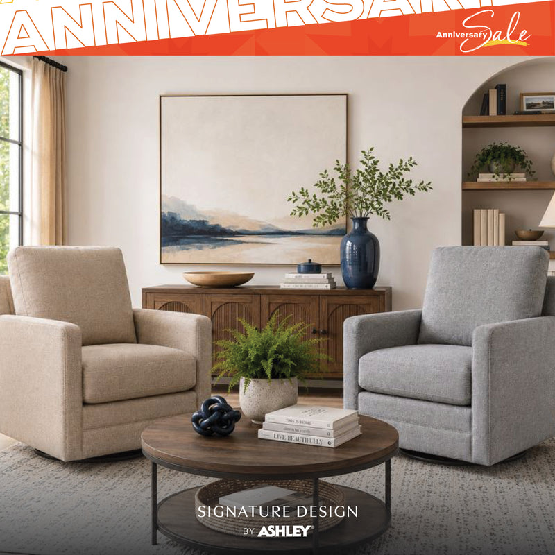 Two armchairs in a living room setting with a stone fireplace and 'Signature Design by Ashley' branding.