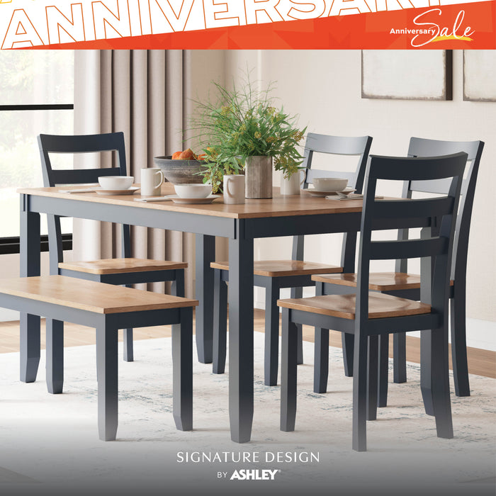 Dining room set with table, chairs, and benches in a home setting, featuring Ashley Furniture branding.