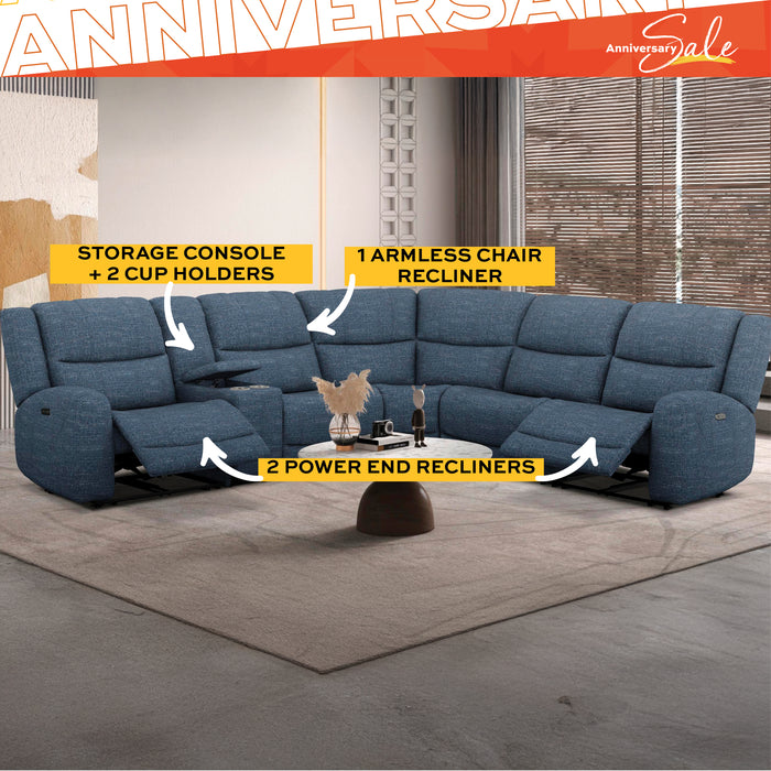 Blue sectional sofa in a living room with bookshelves and a fireplace, featuring 'Anniversary Sale' text.