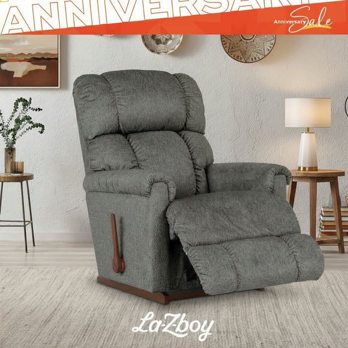 Gray recliner chair in a living room setting with 'LaZboy' branding.