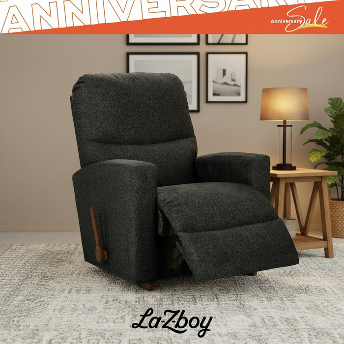 Dark gray recliner chair in a living room setting with 'La Z Boy' branding.