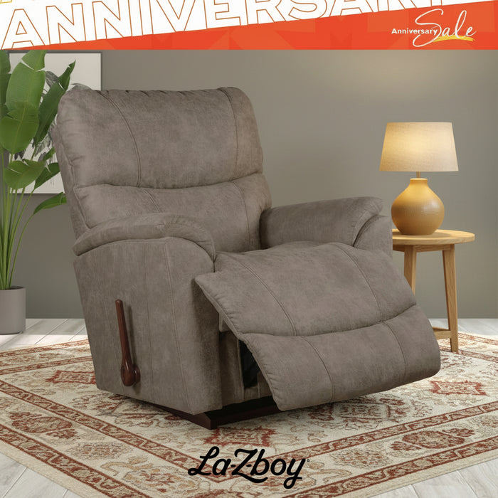 Brown recliner chair in a room with 'LaZboy' branding and 'Anniversary Sale' text.