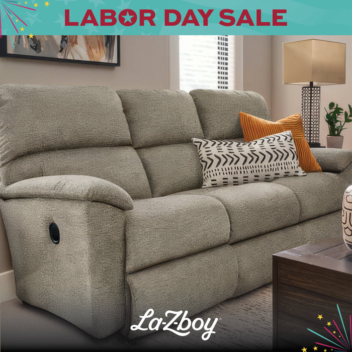 Gray sofa with decorative pillows in a living room setting, featuring La-Z-boy branding and Labor Day Sale text.
