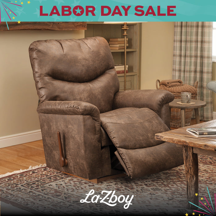 Brown recliner chair in a living room with 'LaZboy' branding and Labor Day sale text.