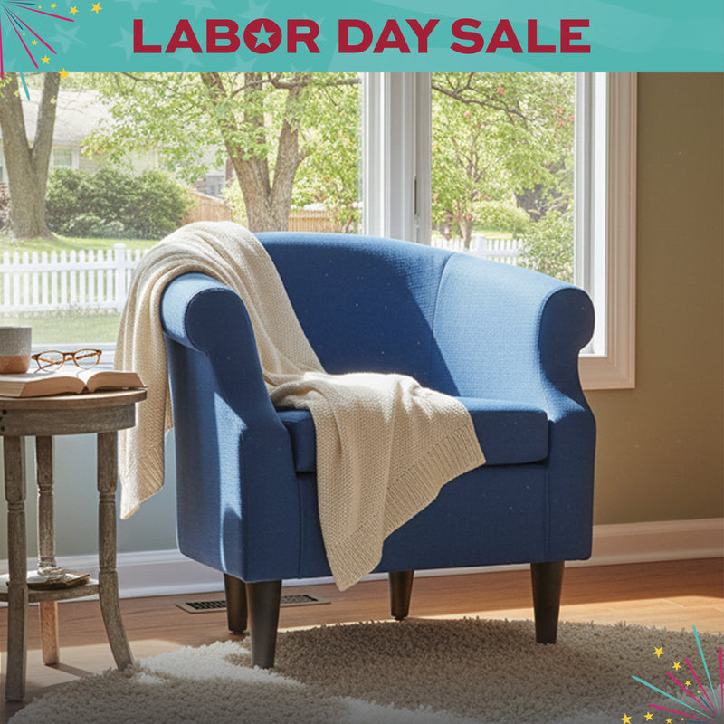Blue armchair with a beige blanket in a room with a window view, Labor Day Sale banner at the top.