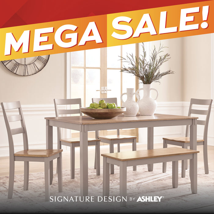 A 5-piece dining room set featuring a rectangular table, four ladder-back chairs, and a bench, shown in a bright dining room setting with a red and orange 'MEGA SALE!' banner overlay and 'SIGNATURE DESIGN BY ASHLEY' text at the bottom.