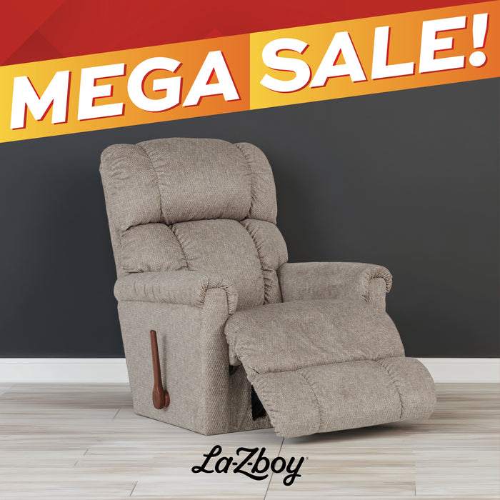 LaZboy upholstered recliner chair in a textured beige fabric, shown reclined with the footrest extended against a dark gray wall and light wood floor. A large orange and red 'MEGA SALE!' banner overlays the top of the image, and the LaZboy logo appears at the bottom.