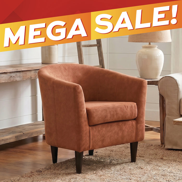 A brown upholstered barrel-style accent chair with dark tapered legs, shown in a styled living room setting with a wooden console table, lamp, rug, and another chair. A large orange and red 'MEGA SALE!' banner overlays the top of the image.