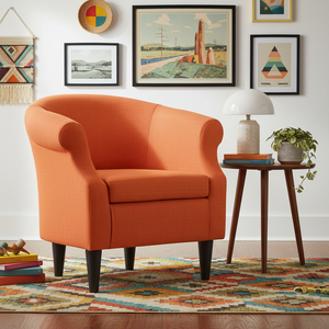 Orange armchair in a room with a colorful rug, side table, and framed artwork on the wall.