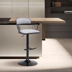 Nash Adjustable Swivel Bar Stool in a modern kitchen beside a counter. 