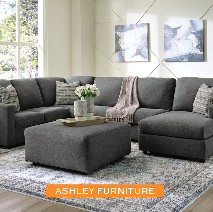 Ashley Furniture Edenfield Sectional and Free Ottoman in a living room