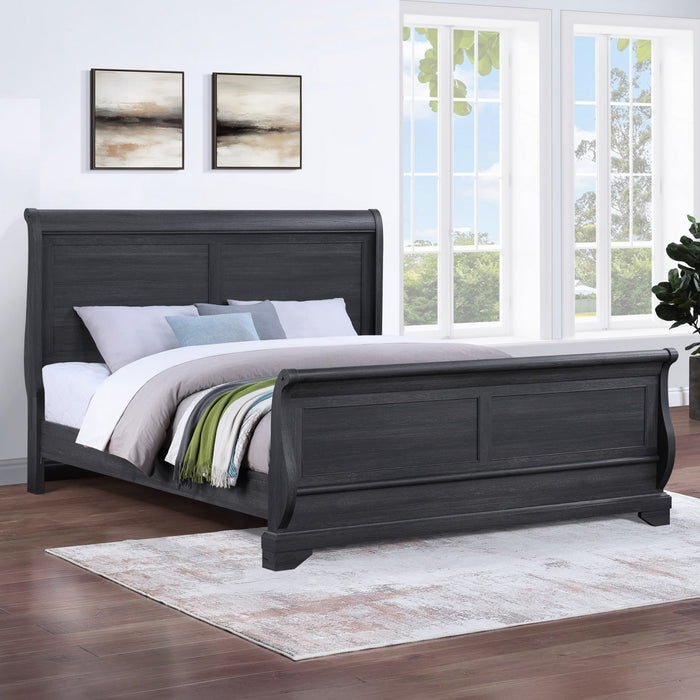 Dark wood sleigh bed in a bedroom with large windows and decorative elements.