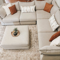White sectional with ottoman