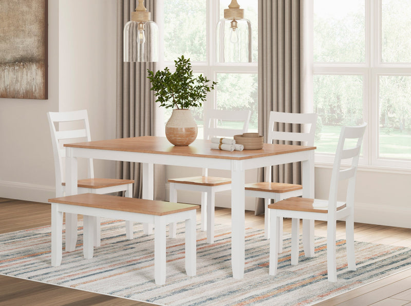 Dining room set with table, chairs, and bench in a bright room with large windows.