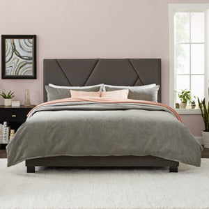 modern bed and upholstered headboard in bedroom